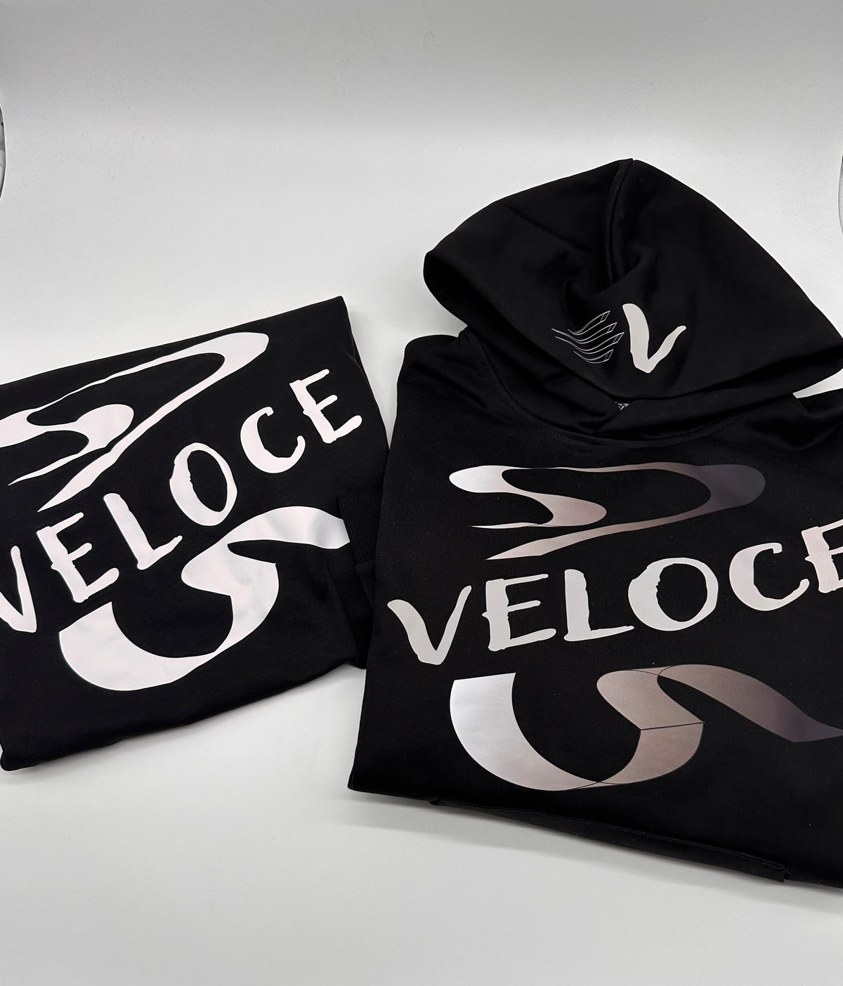 Large white and grey DTF graphic printed on black Veloce apparel