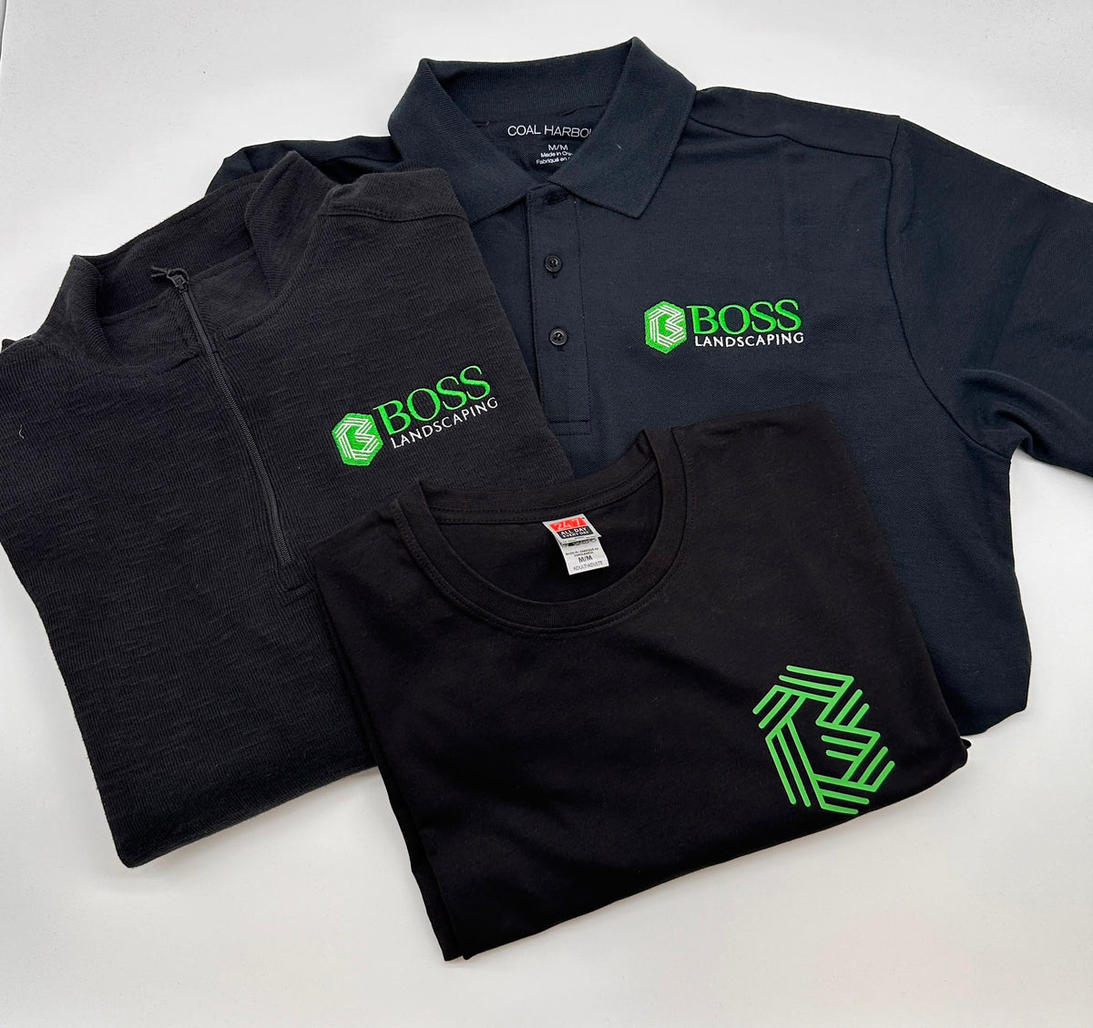 Custom company logo embroidery on polo and quarter-zip apparel