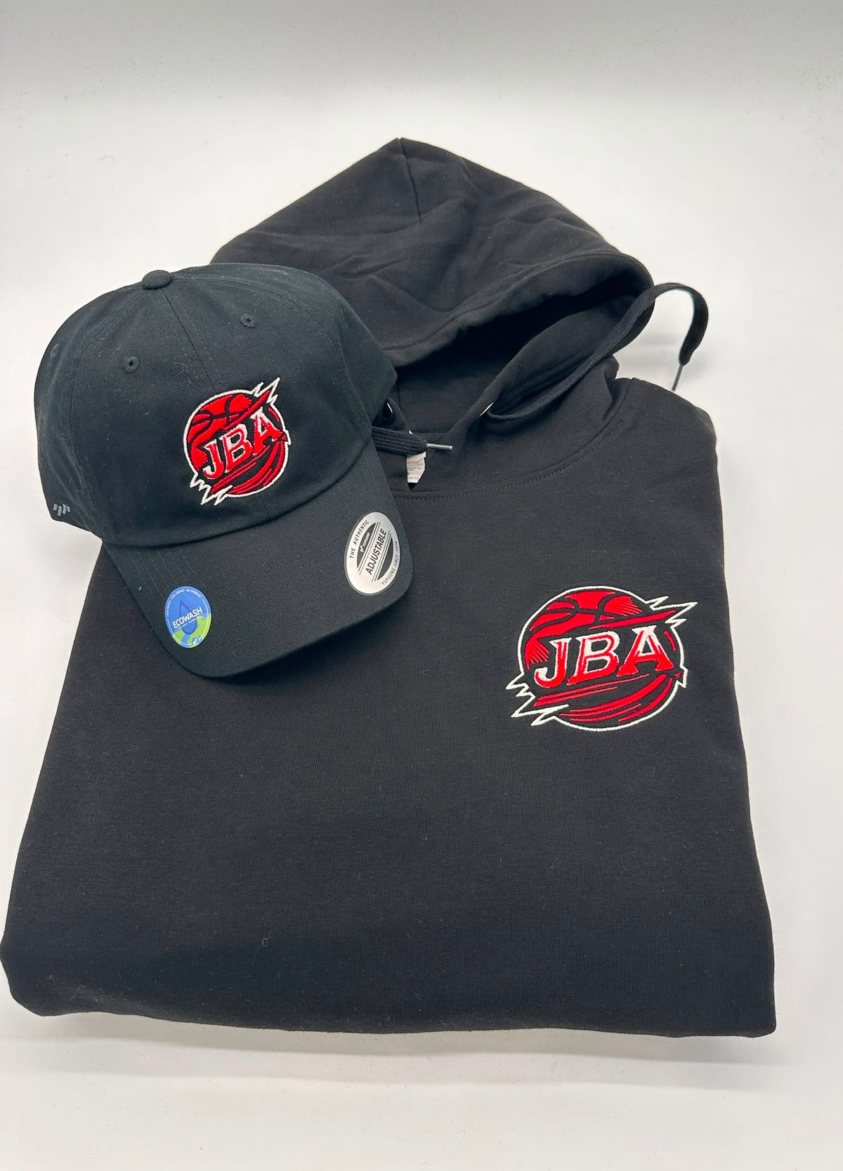Custom embroidered logo on black hoodie and matching hat